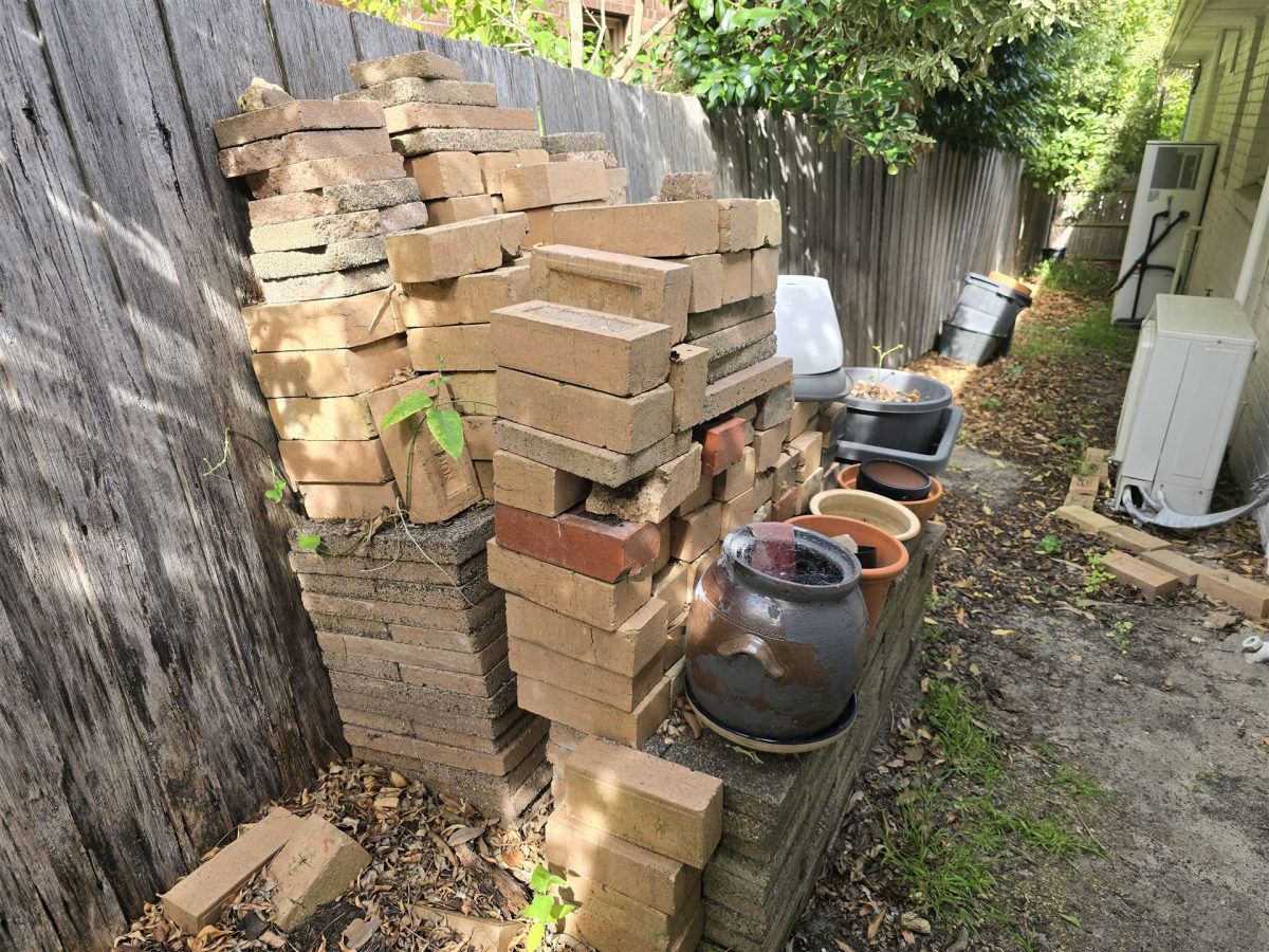 Backyard full of old bricks