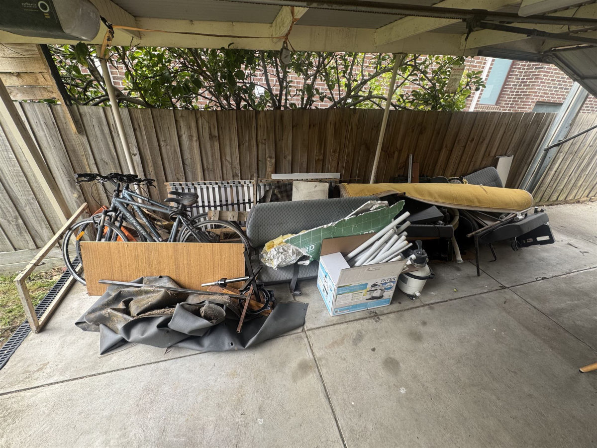 Carport full of bikes and junk