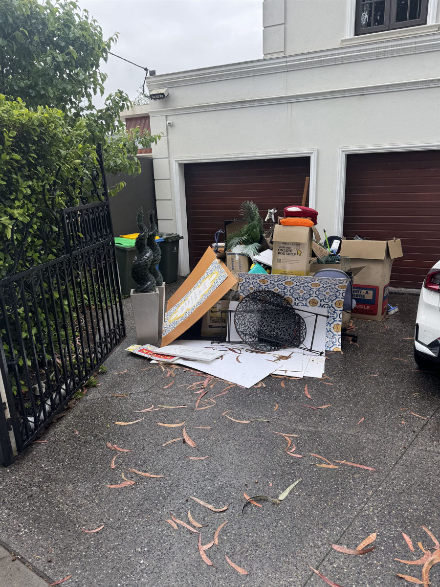 Driveway piled with household items