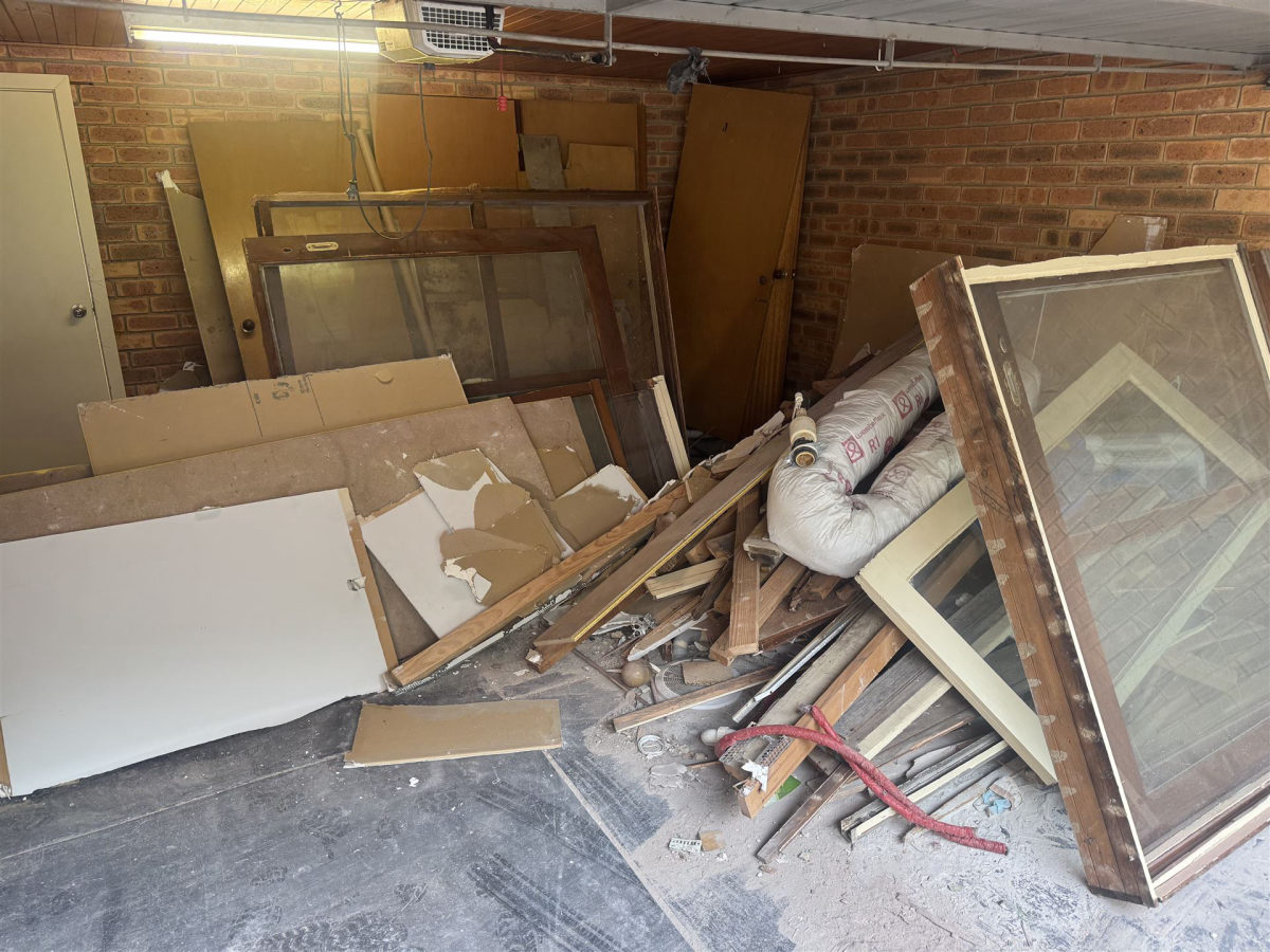 Garage full of old windows and timber frames