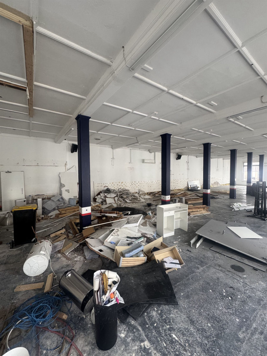 Large commercial space full of renovation debris