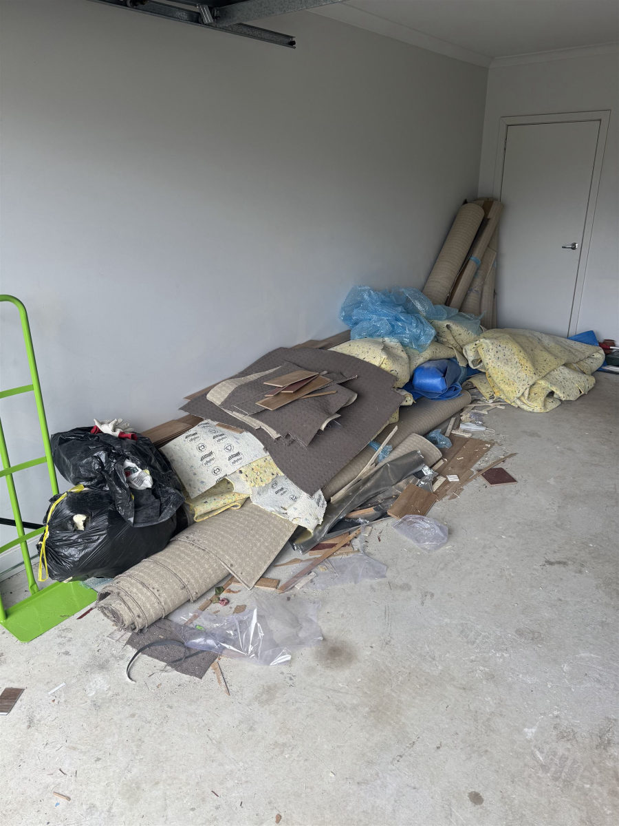 Garage with carpet and renovation materials