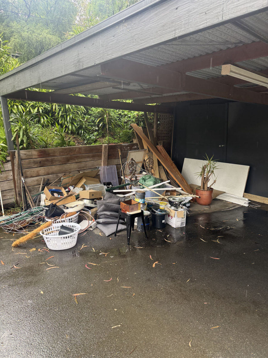 Carport full of old timber and junk