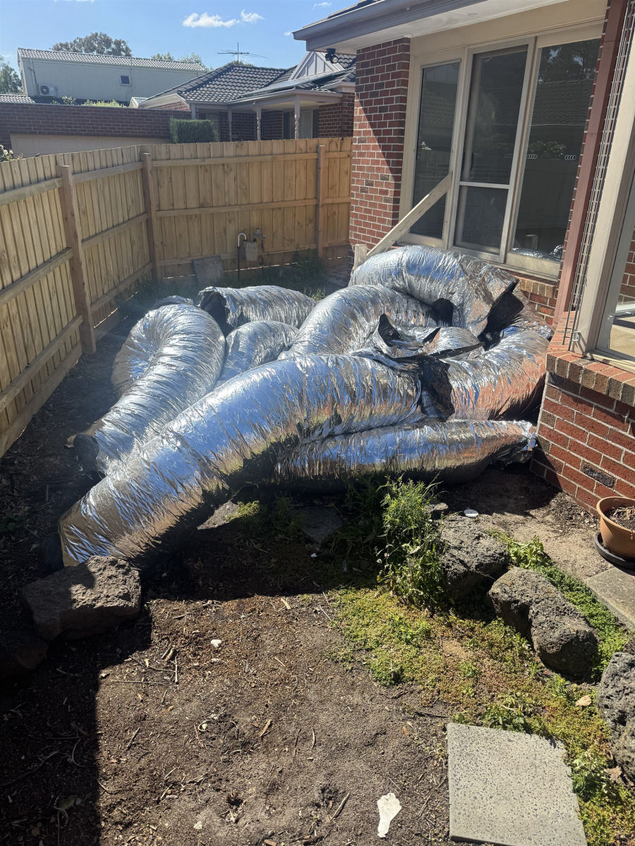 Backyard with large ducting and HVAC waste